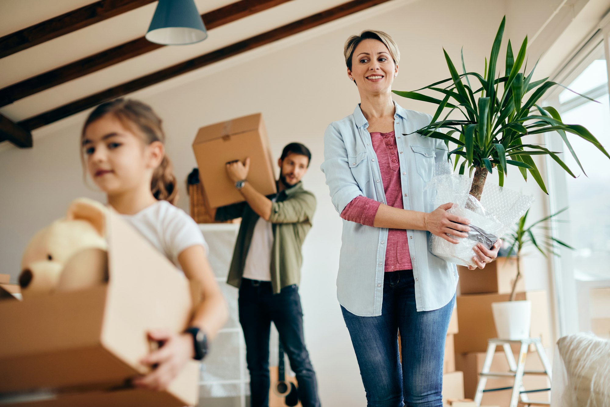 Below view of a family moving into new home.